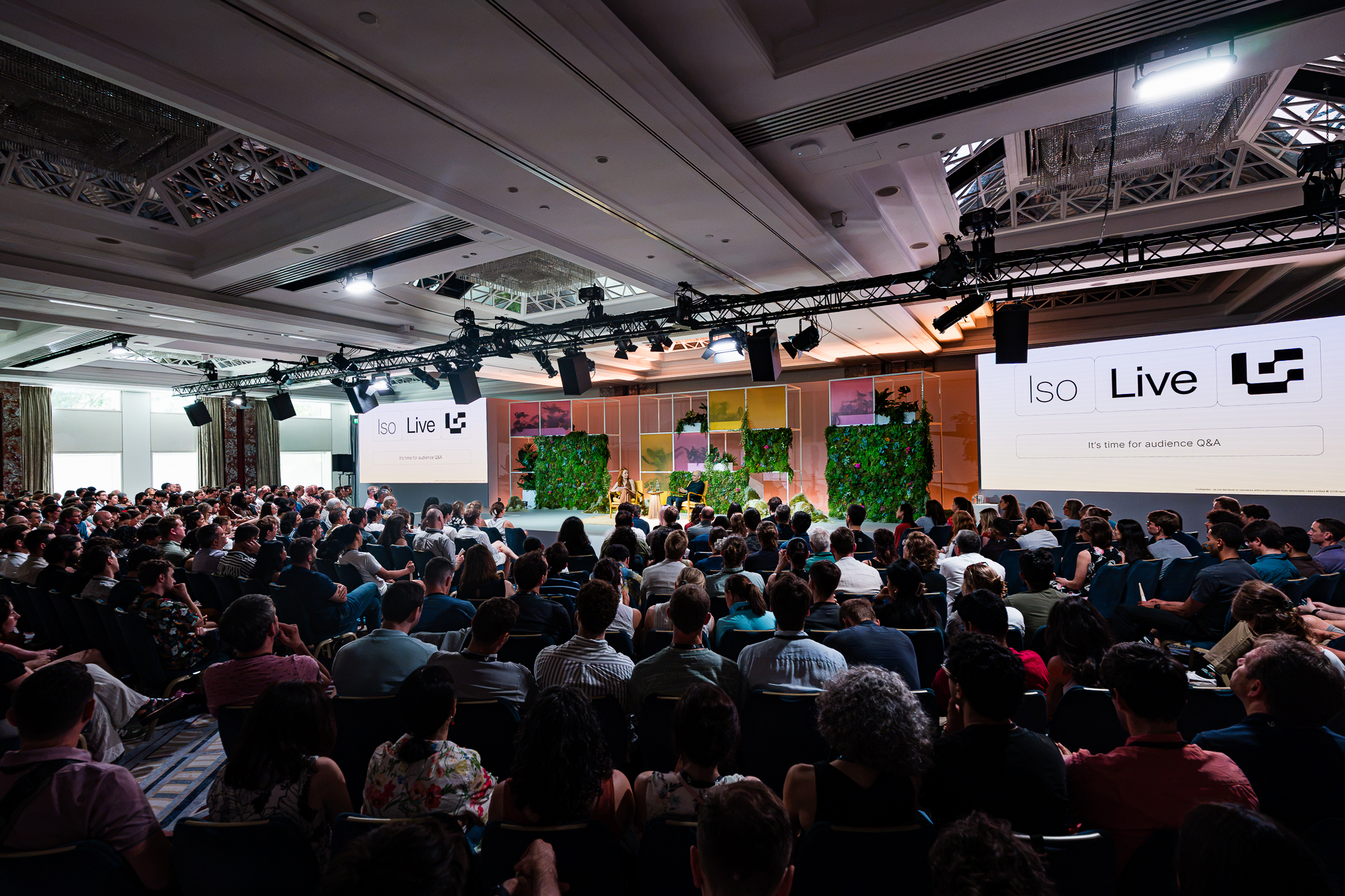 Iso Live 2026 Q&A moment on the main stage, Iso Live logo on screens flanking the audience.